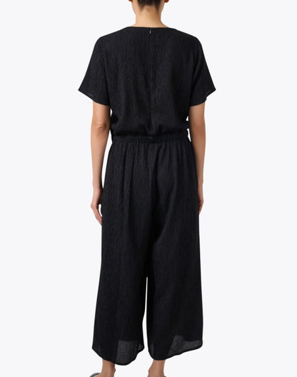 black-plisse-jumpsuit_back.jpeg