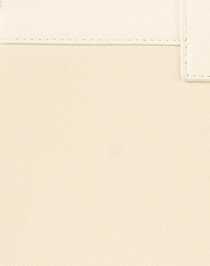 mini-crescent-cream-leather-shoulder-bag_fabric.jpeg