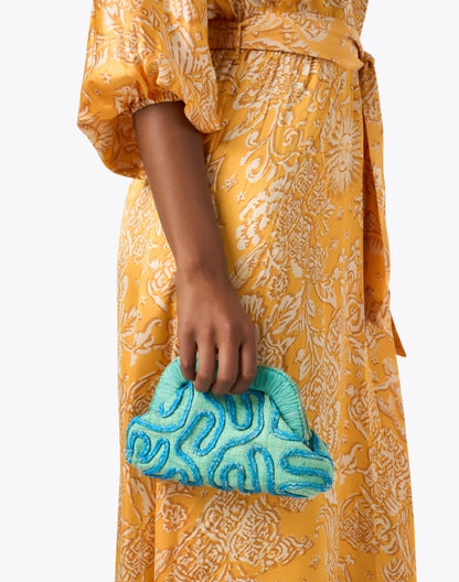 noemi-green-embroidered-raffia-clutch_look.jpeg